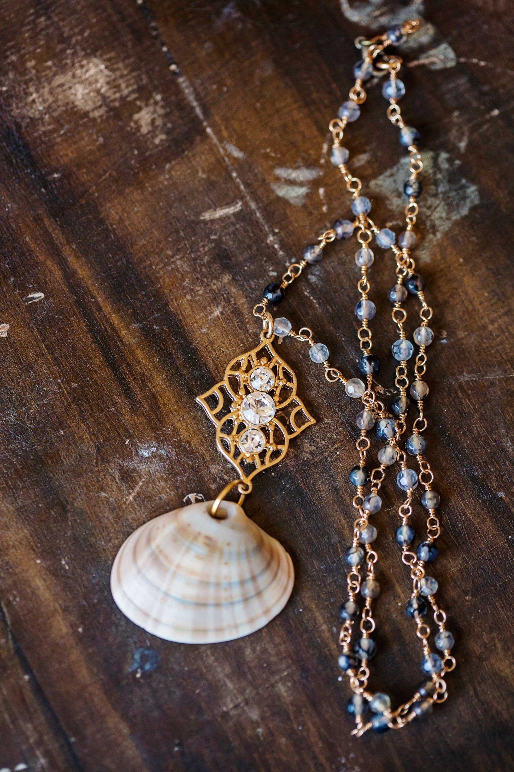 Beautiful romantic necklace on the wooden table